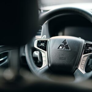 black honda steering wheel in close up photography